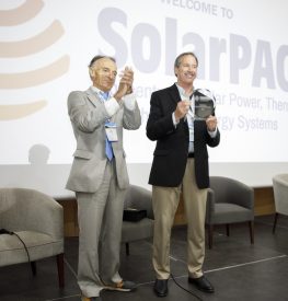 NREL's Mark Mehos accepts the SolarPACES Lifetime Achievement Award he shares with Craig Turchi from Gilles Flamant, Chair of SolarPACES